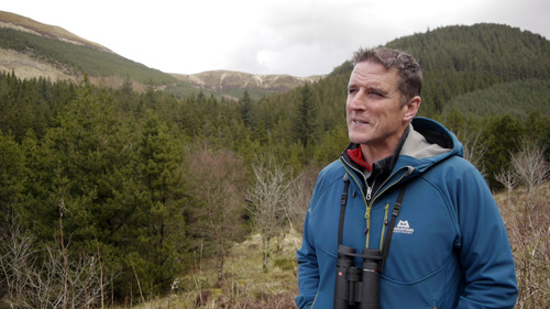 Thumbnail for Wild in Wales - showing Iolo Williams before a Welsh landscape
